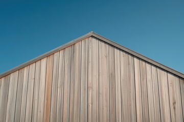 Obraz premium close-up image capturing contrast between rustic textures of weathered wooden barn and gleaming reflective surfaces