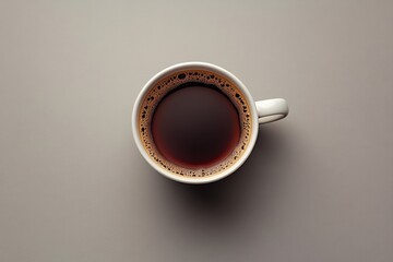 Top view of a hot coffee cup on gray background minimal style.