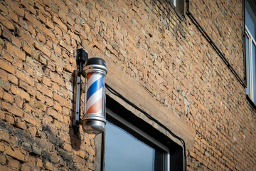 Classic Barber Shop Pole on Brick Wall