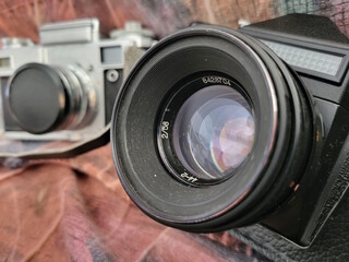 Two old Soviet film cameras close up. Retro lenses.