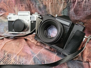 Two old Soviet film cameras close up. Retro lenses.