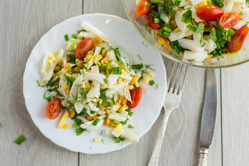 Chinese cabbage salad with squid, eggs, tomatoes and other vegetables