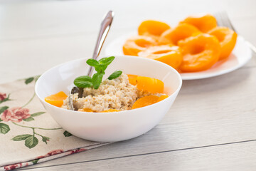 Healthy and balanced breakfast with oatmeal and fruits