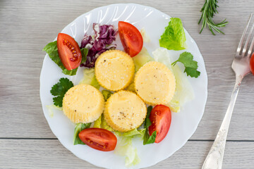 Homemade diet omelette with greens and tomatoes in a cozy atmosphere