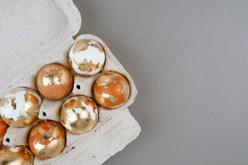 Close up of gold Easter eggs. Easter trendy background.