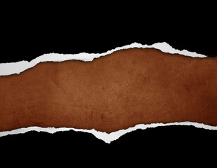 Ripped black paper on brown background