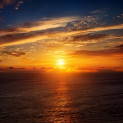 Fototapeta premium The golden sun rises over the horizon, casting warm rays that illuminate the sky