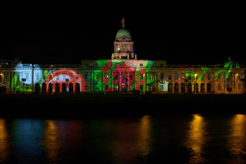 Beautiful static shot of the Custom House building with Christmas projections at night in Dublin. Christmas