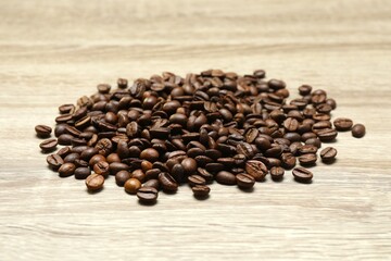 Coffee beans on wooden background