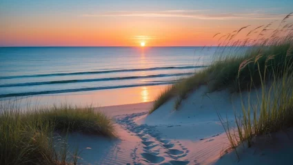 Inviting sunset over the ocean from a dune. Outdoor coastal scene in nature.