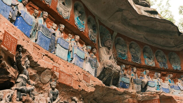 Dazu：A series of Chinese religious sculptures and carvings and UNESCO World Heritage Site located in Dazu District, Chongqing, China. The carvings date back as far as the 7th century AD