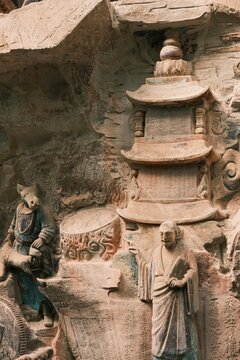 Dazu：A series of Chinese religious sculptures and carvings and UNESCO World Heritage Site located in Dazu District, Chongqing, China. The carvings date back as far as the 7th century AD