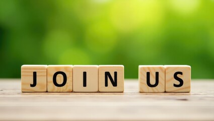 Join us message displayed on wooden blocks against a green backdrop.