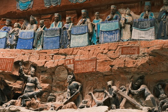 Dazu：A series of Chinese religious sculptures and carvings and UNESCO World Heritage Site located in Dazu District, Chongqing, China. The carvings date back as far as the 7th century AD