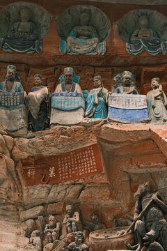 Dazu：A series of Chinese religious sculptures and carvings and UNESCO World Heritage Site located in Dazu District, Chongqing, China. The carvings date back as far as the 7th century AD