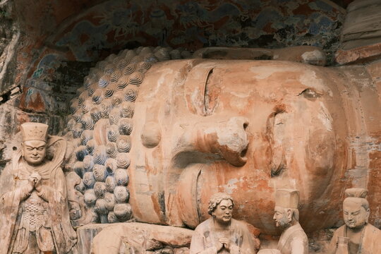 Dazu：A series of Chinese religious sculptures and carvings and UNESCO World Heritage Site located in Dazu District, Chongqing, China. The carvings date back as far as the 7th century AD