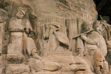 Obraz premium Dazu：A series of Chinese religious sculptures and carvings and UNESCO World Heritage Site located in Dazu District, Chongqing, China. The carvings date back as far as the 7th century AD