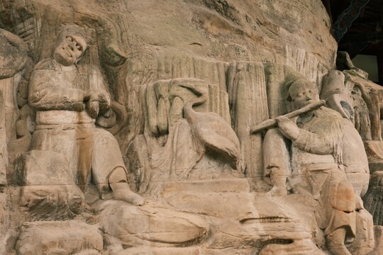 Dazu：A series of Chinese religious sculptures and carvings and UNESCO World Heritage Site located in Dazu District, Chongqing, China. The carvings date back as far as the 7th century AD