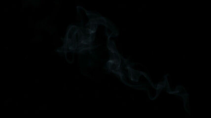 Abstract smoke misty fog on isolated black background. Texture overlays. Divine light through the mystery Paranormal mystic smoke.
