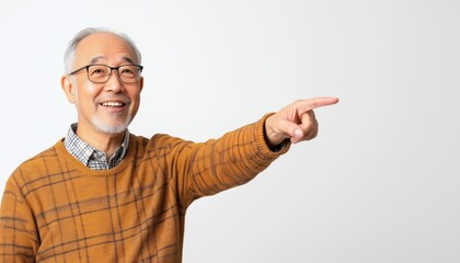 Happy Asian Senior Man Pointing Towards Blank Space On White Background, Smiling Elderly Man Showing Room For Copy.