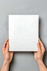Obraz premium Blank paper held in hands (1)