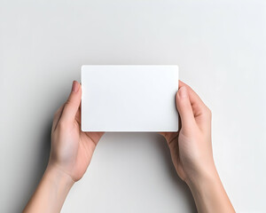 Blank white card held in hands (1)