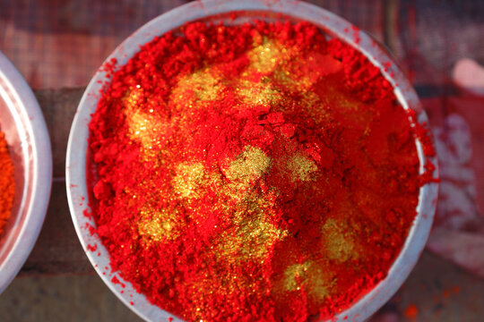 Overhead view of a bowl of gulal powder for sale at a market, Kumbh Mela, Prayagraj, Uttar Pradesh, India