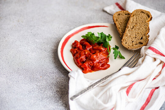 Overhead view of traditional vegetarian Lesco stew with brown bread