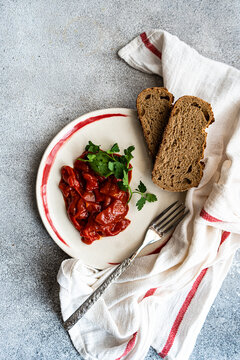 Overhead view of traditional vegetarian Lesco stew with brown bread