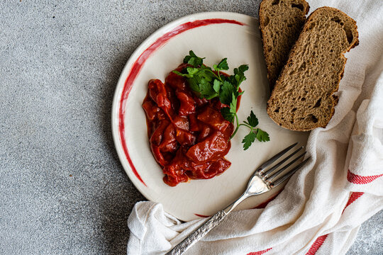 Overhead view of traditional vegetarian Lesco stew with brown bread