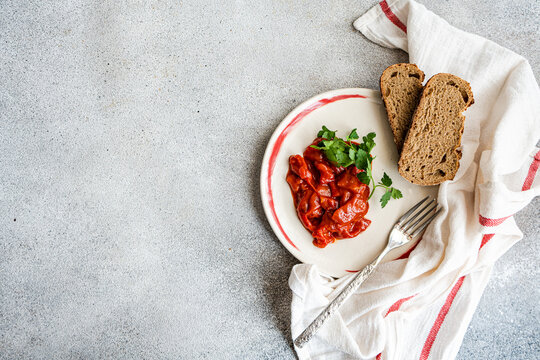 Overhead view of traditional vegetarian Lesco stew with brown bread