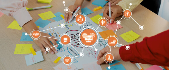 This image showcases a collaborative brainstorming session where hands are actively engaging with colorful sticky notes, reflecting the dynamic nature of team planning and creativity. Amity