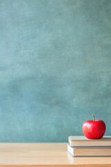 warmly lit classroom scene with empty chalkboard on one side wooden teacher desk neatly organized with red and stack