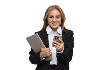 Fototapeta premium Young professional smiles confidently while holding laptop and smartphone in a bright, neutral setting