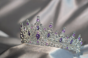 Royal crown with amethyst gemstones, garnets for queen and princess