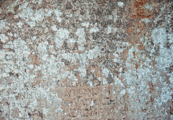 Ancient wall texture background with antique text