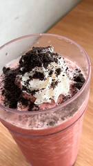 Red velvet frappe with sprinkled choco topping, milk and ice blend together with whip cream and...