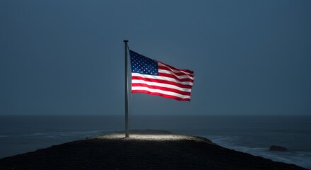 Illuminated American Flag Waving Proudly Against Ocean Backdrop at Dusk