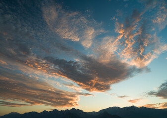 Dramatic sunset or sunrise time dramatic sky over mountain ranges 