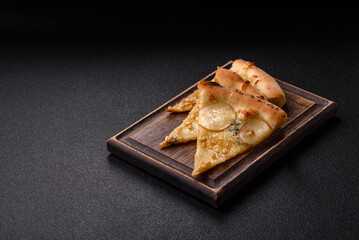 Delicious sweet pizza with pear, gorgonzola cheese and nuts