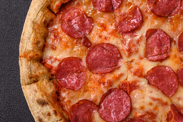 Pepperoni pizza with sausage, cheese, tomatoes, salt and spices