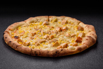 Hawaiian pizza with chicken, pineapple, corn and cheese