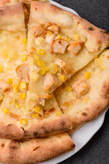 Hawaiian pizza with chicken, pineapple, corn and cheese