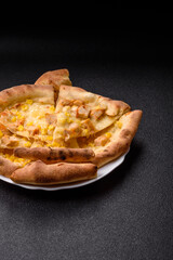 Hawaiian pizza with chicken, pineapple, corn and cheese