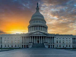 United States Capitol Building under a shining a sun at sunset