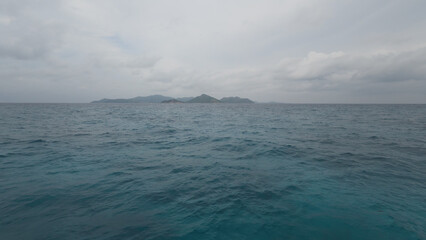 Front view from boat in Indian ocean sailing between Seychelles islands before storm