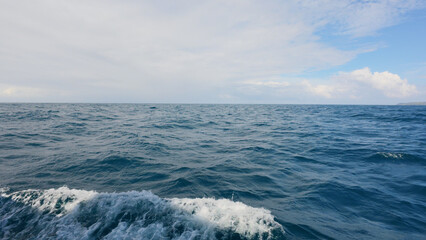Side view from boat in Indian ocean sailing between Seychelles islands in daytime