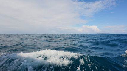 Side view from boat in Indian ocean sailing between Seychelles islands in daytime