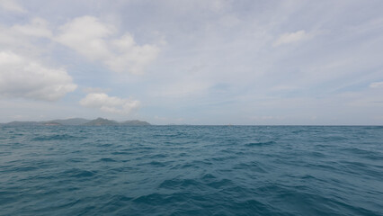 Front view from boat in Indian ocean sailing between Seychelles islands in daytime