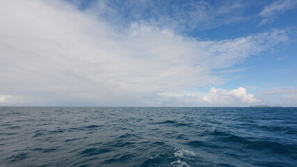 Side view from boat in Indian ocean sailing between Seychelles islands in daytime